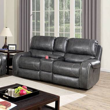 Reclining sofa with nailhead outlet trim